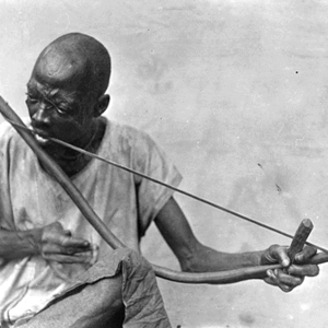 Man playing musical bow